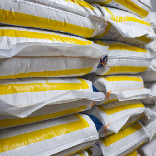 Pile of sack in warehouse. Background and texture of sack stack in warehouse.